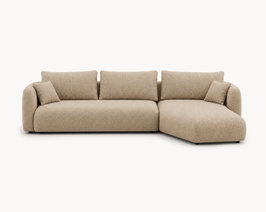 Beige bank Moof met liggedeelte en kenmerkende naar binnen gebogen zijkant.